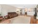 Living room with hardwood floors and view into kitchen at 7244 S Sunrise Way, Buckeye, AZ 85326