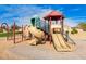 Community playground with slides and climbing structures at 7244 S Sunrise Way, Buckeye, AZ 85326