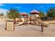 Two play structures with slides and climbing features for children at 7244 S Sunrise Way, Buckeye, AZ 85326