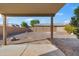 Covered patio overlooking a gravel backyard at 7504 S Sundown Ct, Buckeye, AZ 85326