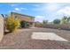 House exterior and large gravel backyard at 7504 S Sundown Ct, Buckeye, AZ 85326