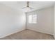 Bright bedroom with carpeted floor and window coverings at 7504 S Sundown Ct, Buckeye, AZ 85326