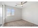 Bright bedroom with carpeted floors and window coverings at 7504 S Sundown Ct, Buckeye, AZ 85326