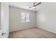 Well-lit bedroom featuring carpet and window blinds at 7504 S Sundown Ct, Buckeye, AZ 85326