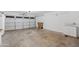 Garage with white cabinets and an overhead door at 7504 S Sundown Ct, Buckeye, AZ 85326