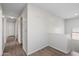 Upstairs hallway with light walls and wood-look flooring at 7504 S Sundown Ct, Buckeye, AZ 85326