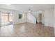 Spacious living room with tile flooring and a view of the staircase at 7504 S Sundown Ct, Buckeye, AZ 85326