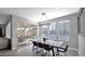 Bright dining room with wooden table and chairs, view of backyard at 7563 E Plata Ave, Mesa, AZ 85212