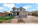 Two-story house with landscaped yard, large driveway and neutral color scheme at 7563 E Plata Ave, Mesa, AZ 85212