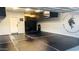 Garage with martial arts flooring and storage at 7563 E Plata Ave, Mesa, AZ 85212