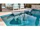 Pool with swim-up bar and mosaic tile at 7563 E Plata Ave, Mesa, AZ 85212