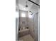 Walk-in shower with built-in seat and tile surround at 7563 E Plata Ave, Mesa, AZ 85212