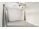 Spacious bedroom with neutral walls, ceiling fan, and grey carpeting at 8131 N 107Th Ave # 76, Peoria, AZ 85345