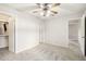 Bedroom with neutral decor, ceiling fan, and ample closet space at 8131 N 107Th Ave # 76, Peoria, AZ 85345