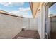 Small, secluded patio with gravel and a small table at 8131 N 107Th Ave # 76, Peoria, AZ 85345