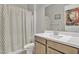 Bathroom features a shower/tub combo, vanity, and patterned curtain at 8448 W Candlewood Way, Florence, AZ 85132