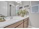 Bright bathroom boasts a double vanity and plenty of natural light at 8448 W Candlewood Way, Florence, AZ 85132