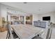 Bright dining area with large table, bench seating, and kitchen views at 8448 W Candlewood Way, Florence, AZ 85132