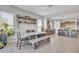 Dining area with a long wooden table and bench seating at 8448 W Candlewood Way, Florence, AZ 85132