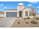 Single-story home with a two-car garage and landscaped front yard at 8448 W Candlewood Way, Florence, AZ 85132