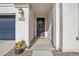 Inviting front entryway with a dark-colored door and a welcome sign at 8448 W Candlewood Way, Florence, AZ 85132