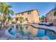 Two story home with a kidney shaped pool and patio furniture at 9022 W Ross Ave, Peoria, AZ 85382