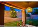 Covered patio with table and chairs overlooking the backyard at 9022 W Ross Ave, Peoria, AZ 85382