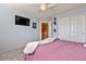 Bedroom with double doors and a staircase view at 9022 W Ross Ave, Peoria, AZ 85382