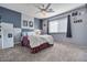 Cozy bedroom with ceiling fan and neutral decor at 9022 W Ross Ave, Peoria, AZ 85382