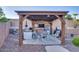 Relaxing outdoor gazebo with seating and a built-in bar at 9022 W Ross Ave, Peoria, AZ 85382