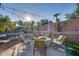 Outdoor patio with fire pit and comfortable seating, adjacent to the pool at 9022 W Ross Ave, Peoria, AZ 85382