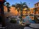 Relaxing pool area with palm trees and lighting at 9022 W Ross Ave, Peoria, AZ 85382