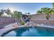 Backyard oasis with a refreshing pool, waterfall, and covered patio at 9022 W Ross Ave, Peoria, AZ 85382