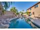 Inviting pool with a waterfall feature and lush landscaping at 9022 W Ross Ave, Peoria, AZ 85382