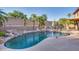 Large kidney-shaped pool with a waterfall feature and spacious patio at 9022 W Ross Ave, Peoria, AZ 85382