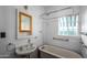 Classic bathroom with vintage tub and updated sink at 903 W Mackenzie Dr, Phoenix, AZ 85013