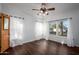 Bright bedroom featuring hardwood floors and ample natural light at 903 W Mackenzie Dr, Phoenix, AZ 85013