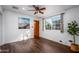 Bright bedroom with dark wood floors and ceiling fan at 903 W Mackenzie Dr, Phoenix, AZ 85013