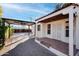 Front porch with decorative door and covered parking at 903 W Mackenzie Dr, Phoenix, AZ 85013