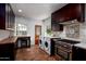 Updated kitchen with butcher block counter, stainless steel appliances, and laundry area at 903 W Mackenzie Dr, Phoenix, AZ 85013