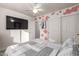 Cozy bedroom with a unique wall design and ceiling fan at 9823 E Escondido Ave, Mesa, AZ 85208