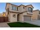 Two-story house with a gray garage door and artificial turf at 9823 E Escondido Ave, Mesa, AZ 85208