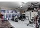 Spacious garage with room for motorcycles, exercise equipment, and a lounge area at 9823 E Escondido Ave, Mesa, AZ 85208