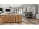 Kitchen island with seating and view into dining area at 9823 E Escondido Ave, Mesa, AZ 85208