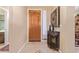 Interior entryway with wood door and decorative console table at 10173 E Conieson Rd, Scottsdale, AZ 85260