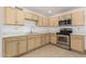 Well-equipped kitchen boasts ample cabinetry and stainless steel appliances at 1123 N 60Th Dr, Phoenix, AZ 85043