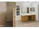 Clean bathroom with double sinks and a large walk-in shower at 13033 W Avalon Dr, Avondale, AZ 85392