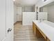 Modern bathroom with double vanity and walk-in shower at 13033 W Avalon Dr, Avondale, AZ 85392
