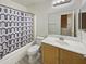 Clean bathroom with tub, shower, and wood vanity at 13033 W Avalon Dr, Avondale, AZ 85392