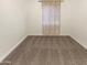 Spacious bedroom with carpet and window coverings at 13033 W Avalon Dr, Avondale, AZ 85392